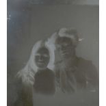 A large collection of early 20th century glass plate negatives showing family portraits,