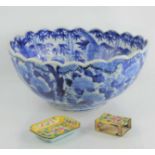 A 19th century Chinese blue and white bowl with scalloped edge and decorated with flowers, birds and