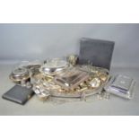 A large quantity of silverplate to include cutlery, serving dishes, toast rack, milk jug and other