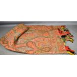 A vintage Paisley shawl with tassel fringe.