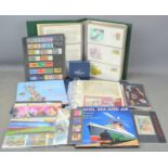 A collection of first day covers and mint stamps to include the official collection of world