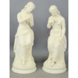 A pair of bisque female figurines holding doves31cm high