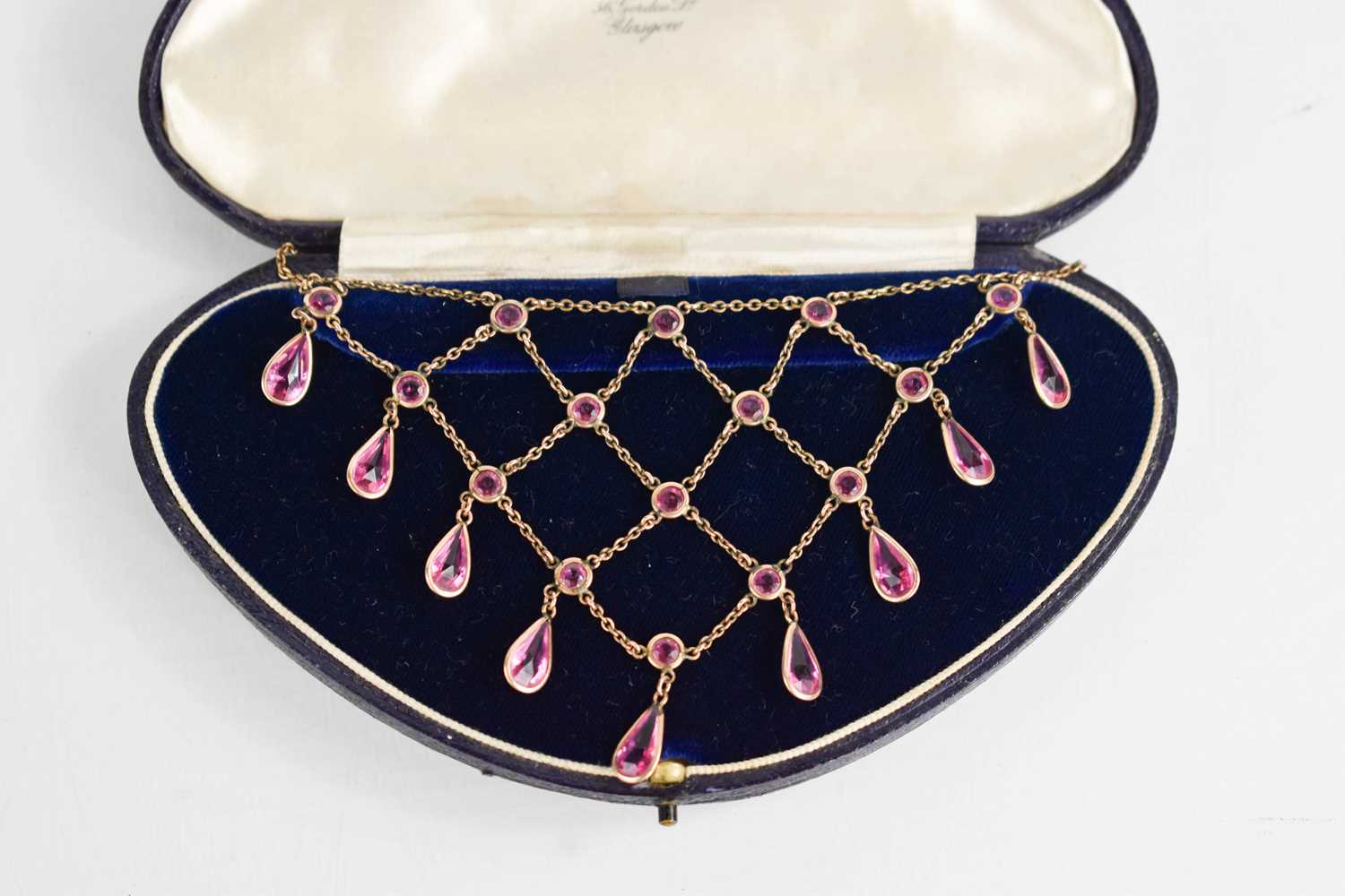 A vintage waterfall necklace, set with pink paste stones, in a presentation box labelled Miller & - Image 2 of 2