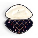 A vintage waterfall necklace, set with pink paste stones, in a presentation box labelled Miller &