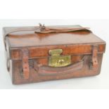 A late 19th century leather cartridge case fitted with four compartments, brass lock, with