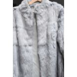 A Vintage angora jacket, size 12, a faux fur full length coat, UK size 10, and a clutch bag.