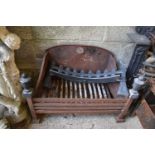 A cast iron antique fire grate. * Please note that this is at the Stamford saleroom.