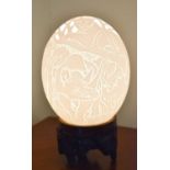 A vintage carved Ostrich egg made into a lamp