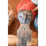 A silver page marker in the form of an owl head, together with a 19th century carved Chinese