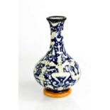 A continental pottery baluster vase with blue ground, depicting winged figures, signed M Pesaro to