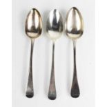 Three silver serving spoons, two London 1764 and one London 1807, 6.6toz.Condition report: Wear