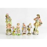 Two pairs of German porcelain figurines and two other figures.