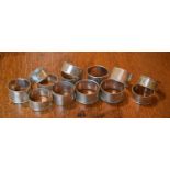 A group of thirteen silver napkin rings of various form and design including a set of six, 7.9 toz