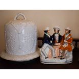 A Victorian Staffordshire figure group, tavern scene with three men, 21cm high together with a