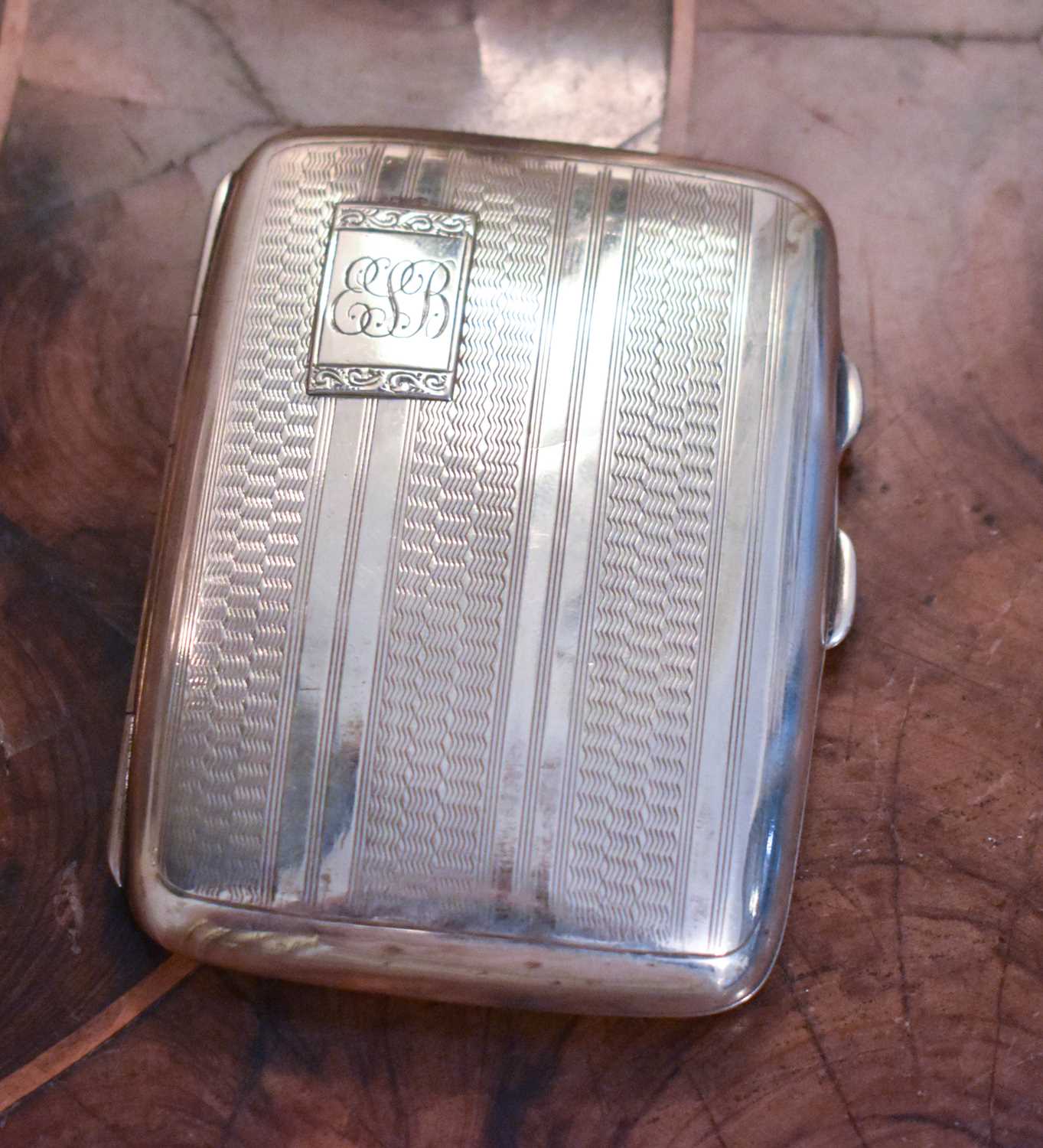 A silver cigarette case, engraved Edith J Sutton, 1953, Chester 1934, machine engraved, 7.02toz.