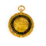 A 9ct gold Lincoln district village football competition medal, 1930-31, 7.3g