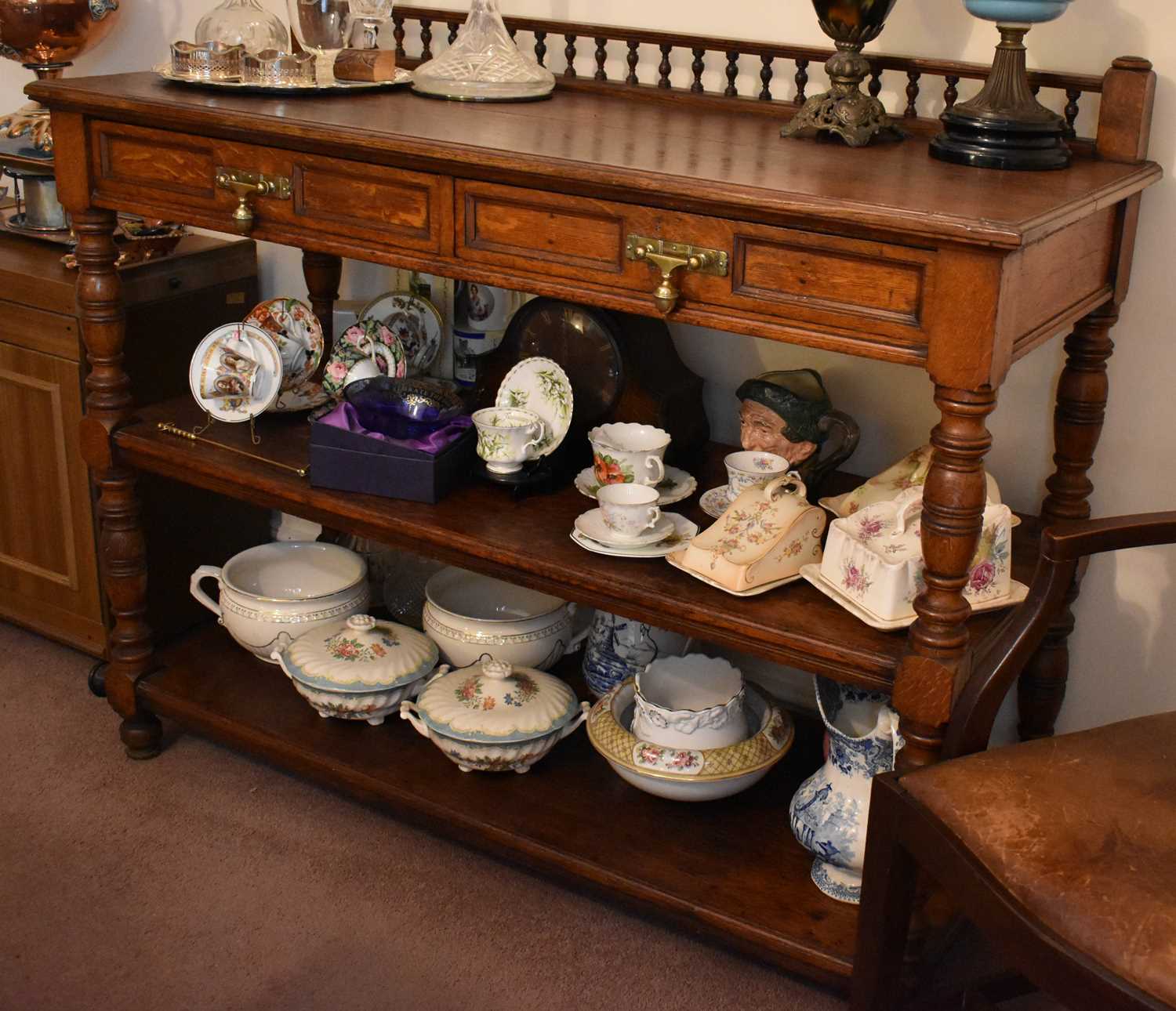 A oak 19th century buffet, three tiers, the upper tier having galleried back and two drawers with