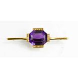 A 9ct gold (tested as), amethyst, and diamond set brooch, the large octagonal cut amethyst, with