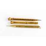 Three 19th century rolled gold propelling pencils, two machine engraved, and one inset with