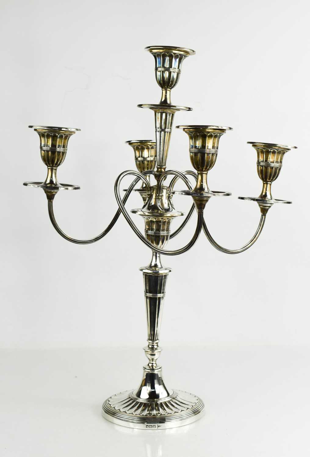 A Walker and Hall silver five light candelabra, with four scrolling branches to fluted sconces,
