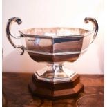 A silver bowl on stand with pedestal base and twin handles engraved with initials W.S and dated