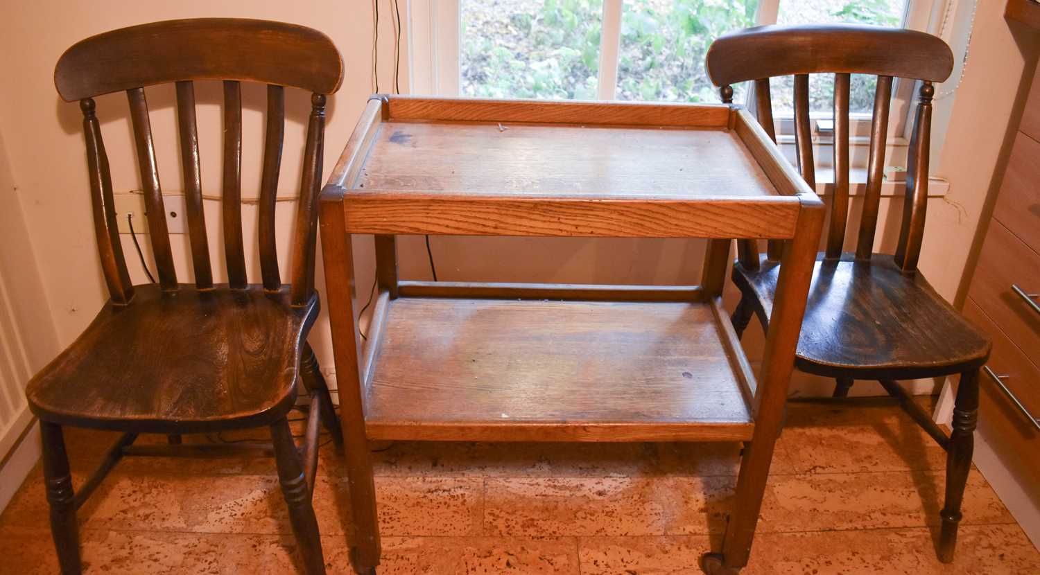 A pair of Victorian kitchen chairs, together with an oak trolley and a drop leaf dining table.
