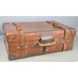 A late19th century leather travelling trunk / case with brass mounted lock, leather stitched