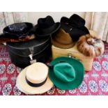 Two vintage hat boxes containing various vintage hats including a mink example, a Harrods of