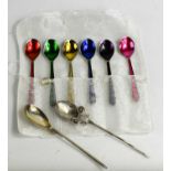 A set of vintage enamel spoons, and two silver spoons.