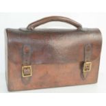 An early 20th century leather satchel with original straps and handle