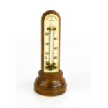 A Negretti Zambra of London table thermometer.13.5cm high