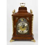 A Warmink Wuba mahogany and brass mantle clock with acorn finials, eight day movement, moon phase