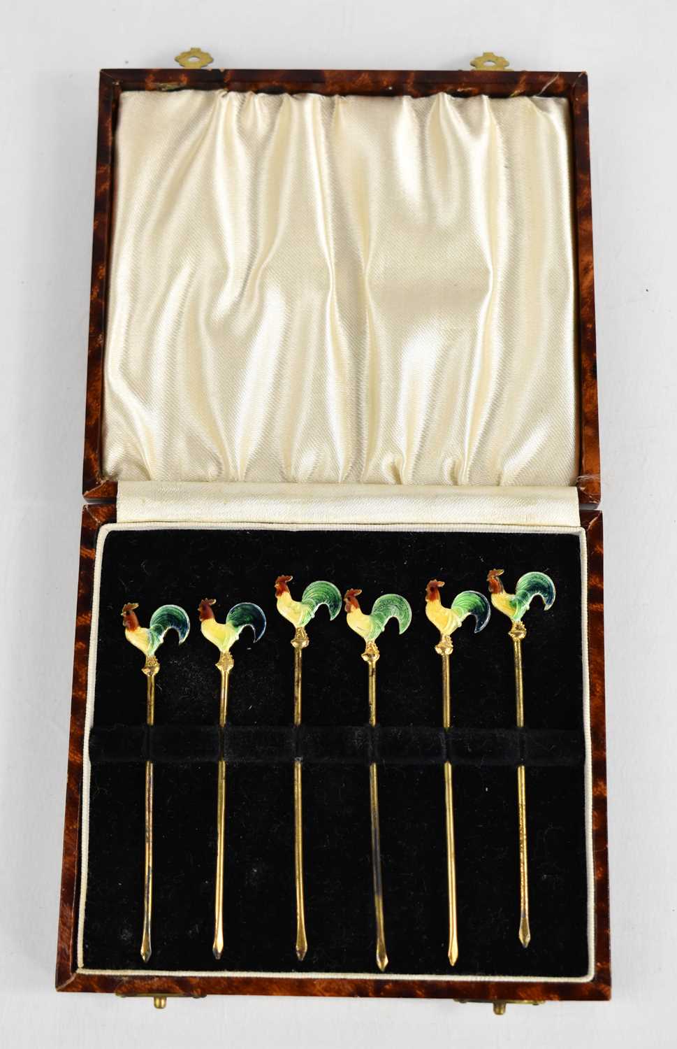 A set of six enamelled cocktail sticks in the form of cockerels, in presentation caseCondition