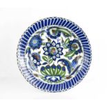 A 19th century Cantagalli Iznik-Style pottery dish, Italy, with scalloped edges, painted in