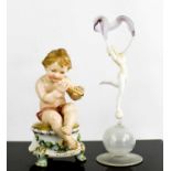 A Karl Ens porcelain figure of a cherub (lacking wings), raised on a footed plinth, together with