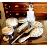 A silver hairbrush and mirror set together with a cut glass perfume bottle and other items