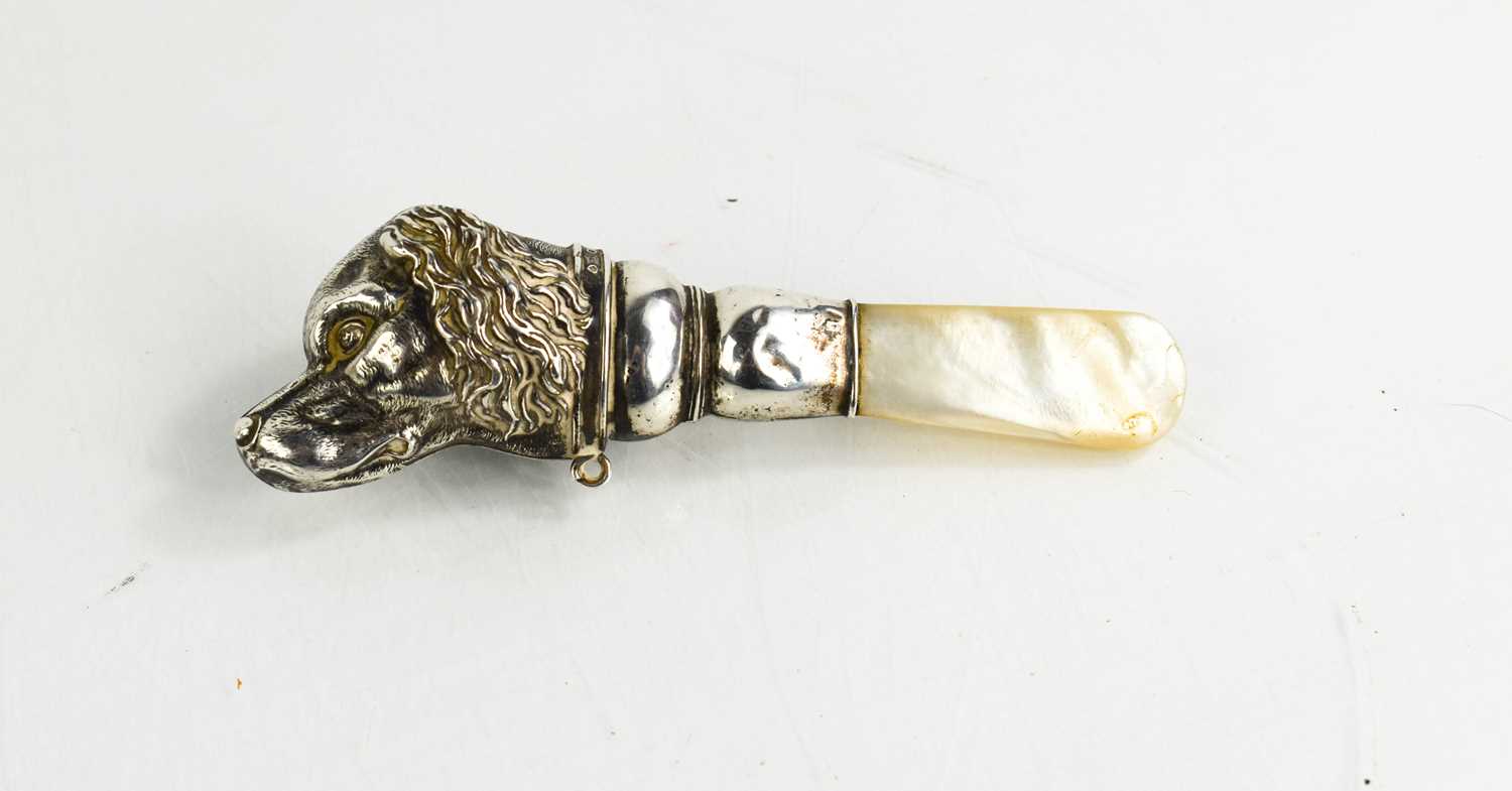 A Victorian silver and mother of pearl teether, the handle in the form of a cocker spaniel head,