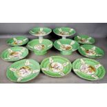 An early 20th century porcelain green ground part dinner set with comports.