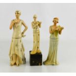 Three Art Deco porcelain figurines, one raised on a plinth 21cm high.