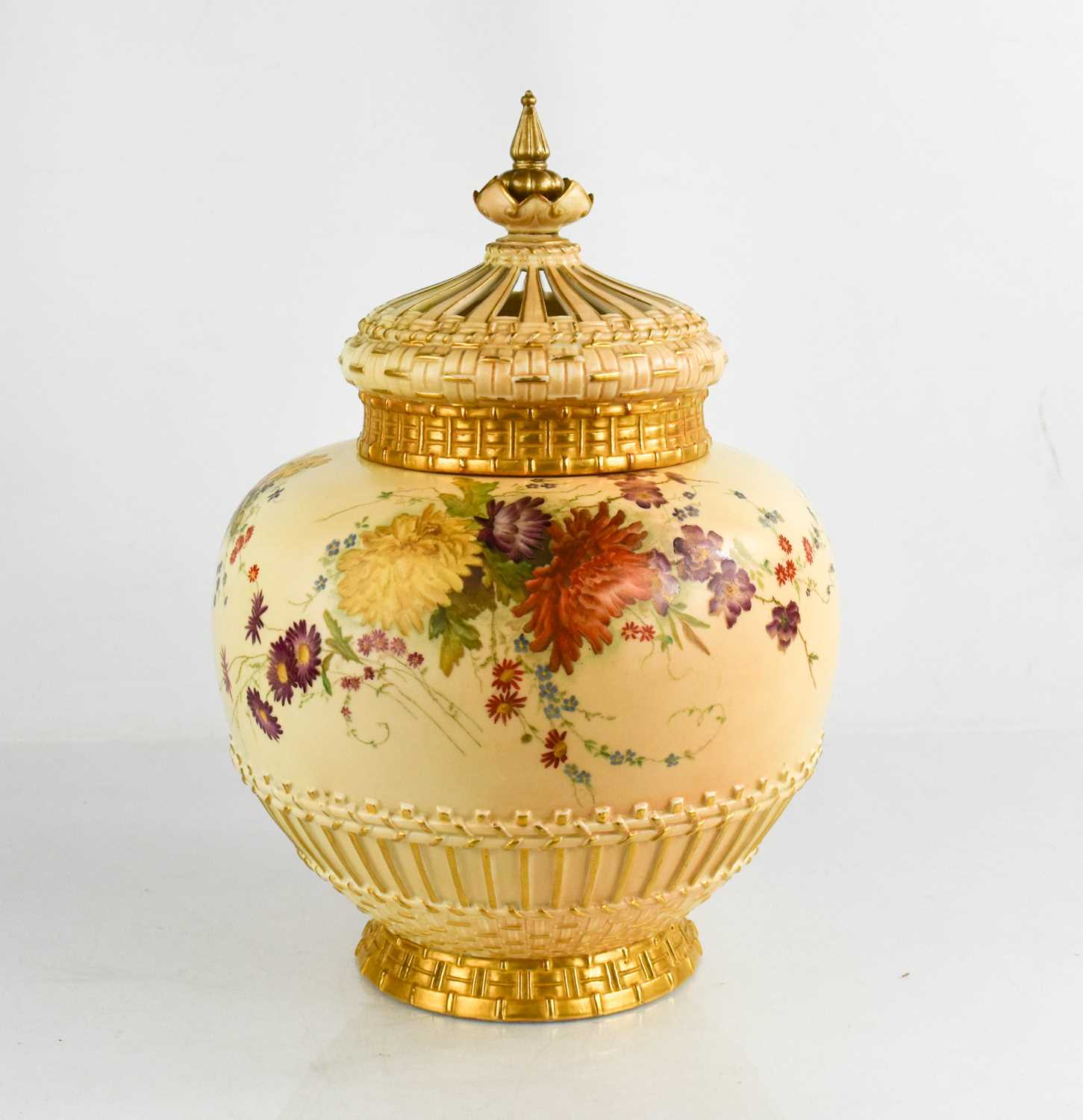 A Royal Worcester pot pourri vase and cover, painted with summer flowers on a blush ivory ground,