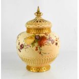 A Royal Worcester pot pourri vase and cover, painted with summer flowers on a blush ivory ground,