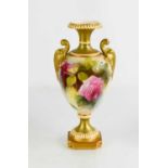 A Royal Worcester urn shaped vase, painted with roses, no. 1969 to the base, 18cm high.