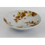 A 20th century Chinese bowl, bearing red calligraphy marks to the base, decorated with berries and