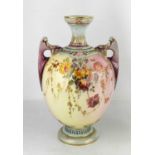 A Royal Worcester vase, painted with flowers to a cream and purple ground, with twin purple