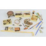 A group of collectibles to include pen nibs, bone handled pencil, white metal watch chain and
