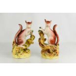 A pair of late 19th century Staffordshire squirrels, 22cm high.