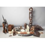 A group of 20th century African carvings, to include carp, figures, animals and a tankard.