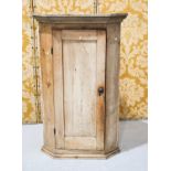 A antique pine corner cupboard with two interior shelves109cm by 60cm