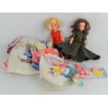 A group of vintage Sindy dolls and clothing