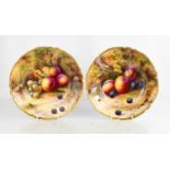 A fine pair of Royal Worcester bowls by Horace Price, painted with peaches and grapes, puce mark
